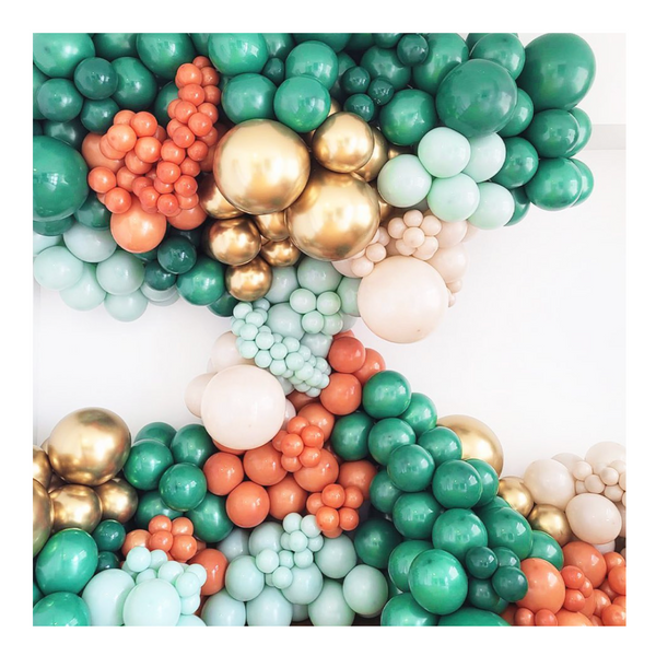 Green, gold and rusty orange wild balloon installation